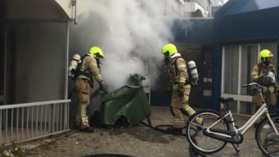 Middelbrand door brand in container