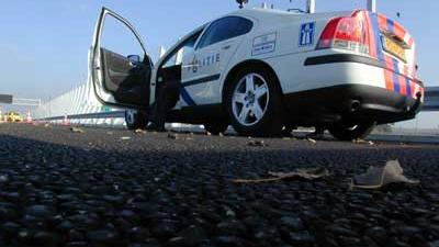 Foto van politieauto op vluchtstrook snelweg | Archief EHF Foto van politieauto op vluchtstrook snelweg | Archief EHF
