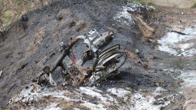 Foto van verbrande heide en scooter